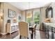 Charming dining area features a wooden table, comfortable seating, and access to the kitchen space at 10531 Cleary Trce, Fishers, IN 46040