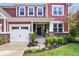 Charming home featuring a well-maintained front yard and covered entryway at 10531 Cleary Trce, Fishers, IN 46040