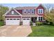 Beautiful two-story home featuring a three-car garage and well-manicured lawn at 10531 Cleary Trce, Fishers, IN 46040