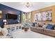 Comfortable living room with a large television, plush seating, and views of the yard at 10531 Cleary Trce, Fishers, IN 46040