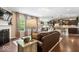Open-concept living room flowing into a modern kitchen with breakfast bar at 10531 Cleary Trce, Fishers, IN 46040