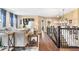 Cozy living room with stairs featuring a wrought iron banister, natural light, and modern fixtures at 10531 Cleary Trce, Fishers, IN 46040