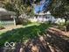 Backyard featuring a lawn and home at 113 1St St, Shelbyville, IN 46176