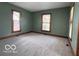 Spacious bedroom featuring fresh paint and neutral carpeting for a welcoming feel at 113 1St St, Shelbyville, IN 46176