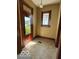 The entryway features a quaint design, natural light, and views to the exterior at 113 1St St, Shelbyville, IN 46176