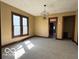Inviting living room with natural light from windows and stylish light fixture at 113 1St St, Shelbyville, IN 46176