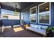 Relaxing back porch featuring cozy seating, string lights, and a ceiling fan at 1226 Cottage Ave, Indianapolis, IN 46203