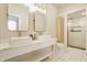 Modern bathroom with double vanity, sleek mirrors, and a glass-enclosed shower at 1226 Cottage Ave, Indianapolis, IN 46203
