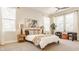Airy bedroom with a plush bed, accent chairs, and plenty of natural light from multiple windows at 1226 Cottage Ave, Indianapolis, IN 46203