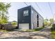 Contemporary home with a garage, modern siding, and a well-maintained driveway at 1226 Cottage Ave, Indianapolis, IN 46203