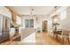 Modern kitchen with stainless steel appliances, a marble island, and an open layout connecting to the dining area at 1226 Cottage Ave, Indianapolis, IN 46203