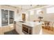 Bright kitchen with a marble island, modern appliances, and an open layout that connects to the dining area at 1226 Cottage Ave, Indianapolis, IN 46203