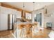Contemporary kitchen boasting a marble island, wooden accents, and stainless steel appliances for a stylish cooking space at 1226 Cottage Ave, Indianapolis, IN 46203