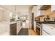 Contemporary kitchen showcasing stainless steel appliances, a white marble island, and an open design at 1226 Cottage Ave, Indianapolis, IN 46203
