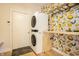 Convenient laundry room with a stacked washer and dryer and ample counter space at 1226 Cottage Ave, Indianapolis, IN 46203