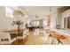Bright, open-concept living space with hardwood floors, modern lighting, and seamless flow to the dining area at 1226 Cottage Ave, Indianapolis, IN 46203