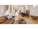 Stylish living room featuring hardwood floors, a comfortable leather sofa, and plenty of natural light at 1226 Cottage Ave, Indianapolis, IN 46203