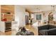 Open-concept living room and kitchen area with hardwood floors and modern design elements at 1226 Cottage Ave, Indianapolis, IN 46203