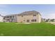 Well-maintained backyard with a spacious lawn and outdoor living space for relaxation and entertainment at 13204 Caterwood Cir, Fishers, IN 46037