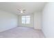 Spacious bedroom featuring a large window providing natural light and a ceiling fan for added comfort at 13204 Caterwood Cir, Fishers, IN 46037
