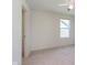 Cozy bedroom with a window and closet showcasing natural light and practical storage solutions at 13204 Caterwood Cir, Fishers, IN 46037