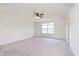 Large bedroom with carpet, ceiling fan and a window at 13204 Caterwood Cir, Fishers, IN 46037