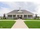 Charming community clubhouse with manicured lawn, offering a welcoming space for residents at 13204 Caterwood Cir, Fishers, IN 46037