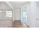 Bright foyer showcasing wood flooring and open access to the living space at 13204 Caterwood Cir, Fishers, IN 46037