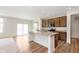 Modern kitchen features a large island with granite countertops, and sleek wooden cabinets at 13204 Caterwood Cir, Fishers, IN 46037