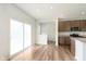 Bright kitchen area with stainless appliances, granite countertops, and sliding glass doors to outside at 13204 Caterwood Cir, Fishers, IN 46037