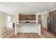 Beautiful kitchen features a center island, granite counters, stainless steel appliances and wood floors at 13204 Caterwood Cir, Fishers, IN 46037
