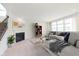 Bright living room features a fireplace, large windows, and modern decor at 13204 Caterwood Cir, Fishers, IN 46037