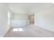 Upstairs living room area featuring neutral carpeting and a window for natural light at 13204 Caterwood Cir, Fishers, IN 46037
