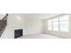 Bright living room features an electric fireplace, carpeted floors and large windows at 13204 Caterwood Cir, Fishers, IN 46037