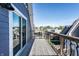 Balcony showing wood flooring, sliding glass doors, and neighborhood views at 1330 Marlowe Ave, Indianapolis, IN 46202