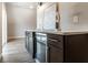 Stylish bar area with sleek countertop, dark cabinets, and a beverage cooler, ideal for entertaining at 1330 Marlowe Ave, Indianapolis, IN 46202