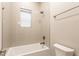 Clean bathroom with white subway tile, a shower and tub combination, and modern fixtures at 1330 Marlowe Ave, Indianapolis, IN 46202