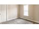 Neutral bedroom with a window allowing plenty of light and neutral carpet at 1330 Marlowe Ave, Indianapolis, IN 46202