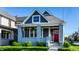 Charming home with a red door, painted brick columns, and a well-kept lawn at 1330 Marlowe Ave, Indianapolis, IN 46202