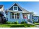 Charming home with a red door, painted brick columns, and a well-kept lawn at 1330 Marlowe Ave, Indianapolis, IN 46202