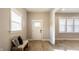 Welcoming foyer with light-colored wood floors, a neutral color scheme, and bench seating at 1330 Marlowe Ave, Indianapolis, IN 46202