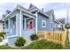 Beautiful two-story home featuring a well-kept lawn, brick porch, and wooden fence at 1330 Marlowe Ave, Indianapolis, IN 46202