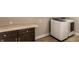 Laundry area featuring a modern washer and dryer with ample cabinet space and a wooden countertop at 1330 Marlowe Ave, Indianapolis, IN 46202