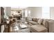 Bright and airy living room featuring modern furnishings and an open concept design to the kitchen and dining area at 1330 Marlowe Ave, Indianapolis, IN 46202