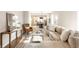 Inviting living room boasts modern decor, neutral tones, and an open layout connecting to the dining area and kitchen at 1330 Marlowe Ave, Indianapolis, IN 46202