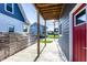 Back patio area features concrete flooring, wood posts, and fence views at 1330 Marlowe Ave, Indianapolis, IN 46202