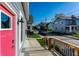 Welcoming front porch and red door with neighborhood views at 1330 Marlowe Ave, Indianapolis, IN 46202