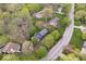 An aerial view showcases the home's placement on a treed lot in a charming neighborhood at 13363 Lantern Rd, Fishers, IN 46038