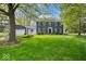 Charming two-story home with an expansive green lawn and well-maintained landscaping at 13363 Lantern Rd, Fishers, IN 46038