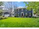 Charming two-story home with an expansive green lawn and well-maintained landscaping at 13363 Lantern Rd, Fishers, IN 46038